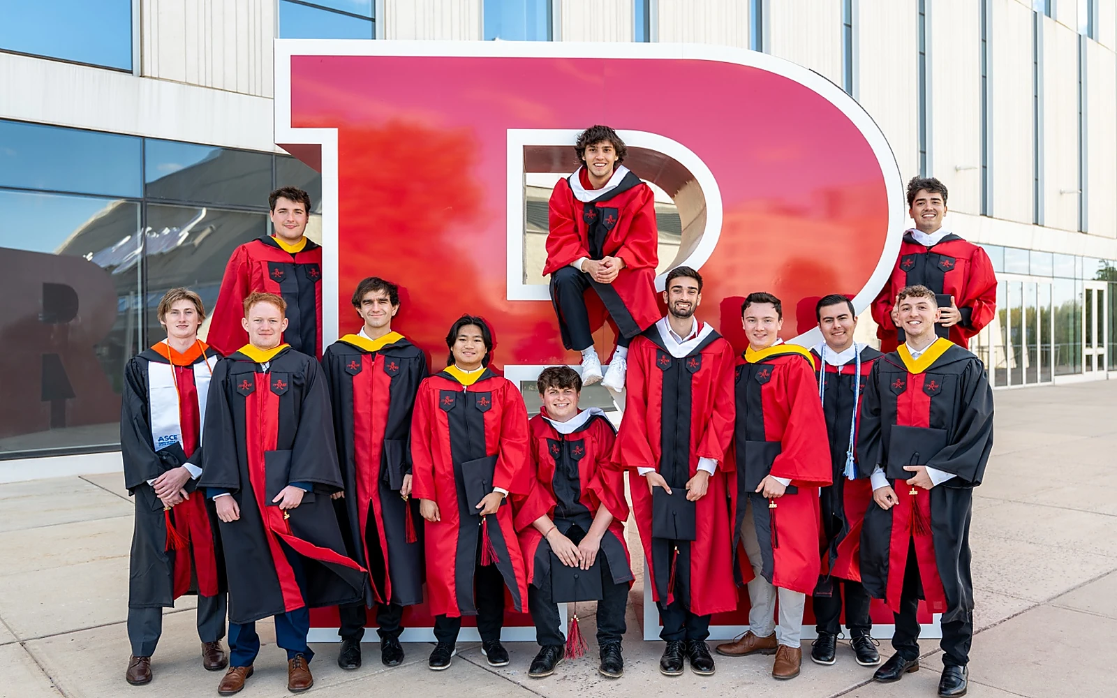 Beta Delta graduates in Rutgers regalia
